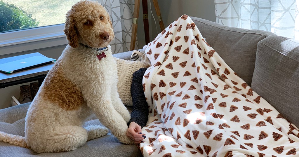 yoli and collin with poop emoji blanket