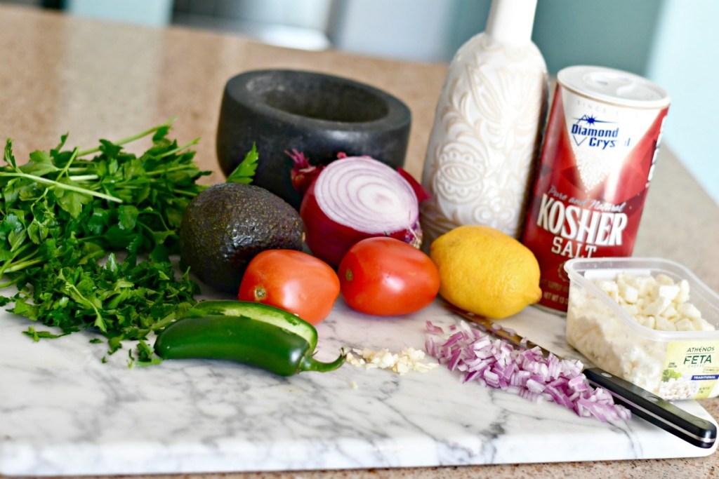 feta salsa ingredients sitting on counter