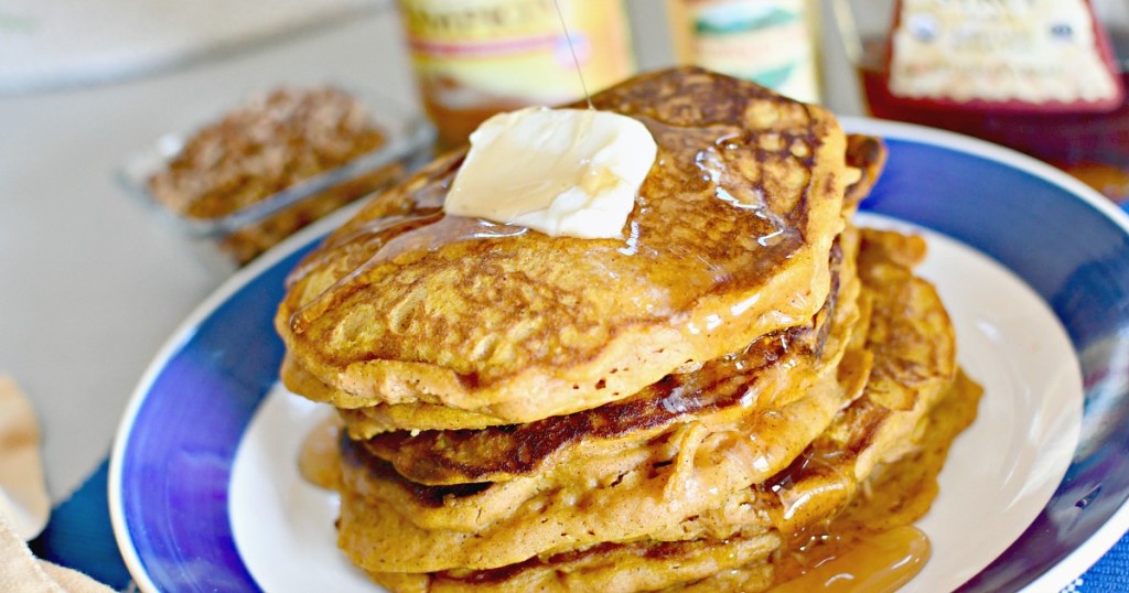 pumpkin spice pancakes with butter on a plate 