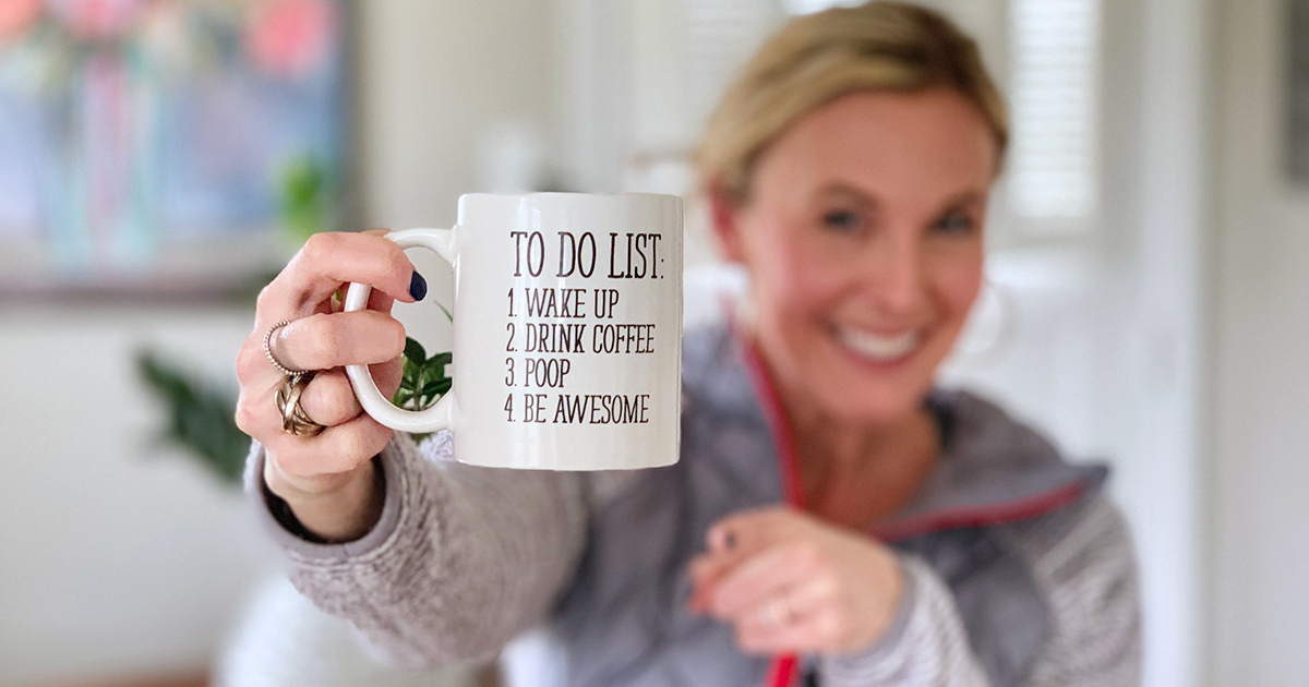 collin holding up to-list coffee mug 