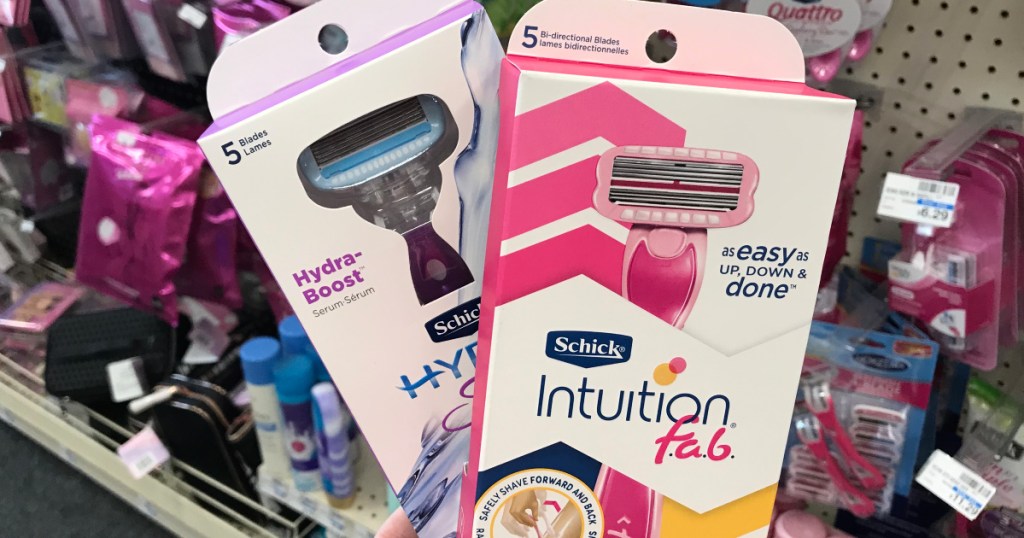 hand holding two Schick razors