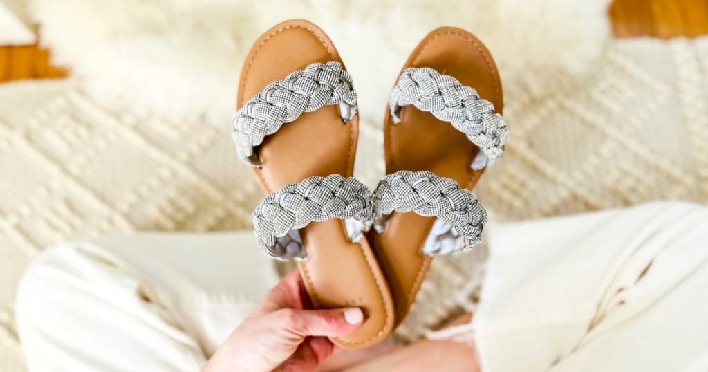 woman's hands holding a pair of target braided sandals