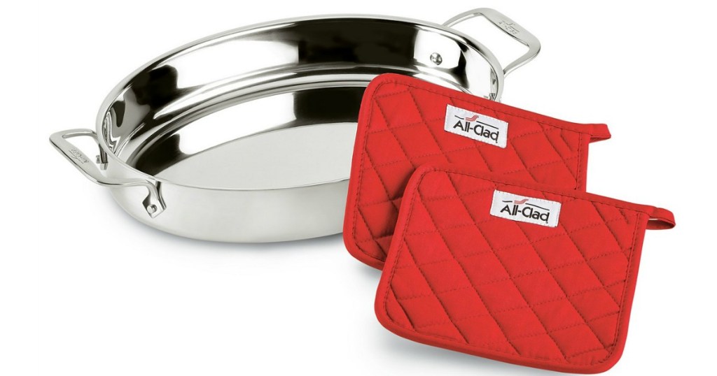 stainless steel pan with 2 red pot holders