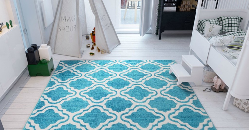 Bedroom with colorful blue rug 