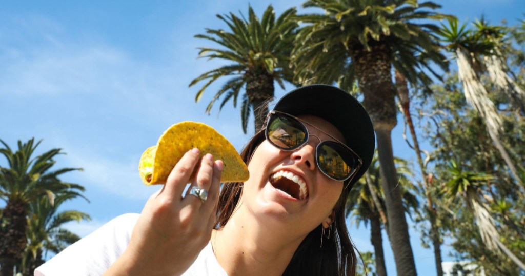 Del Taco girl eating a taco