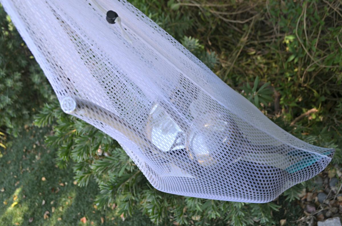 Dollar Tree mesh laundry bag for dishes while camping