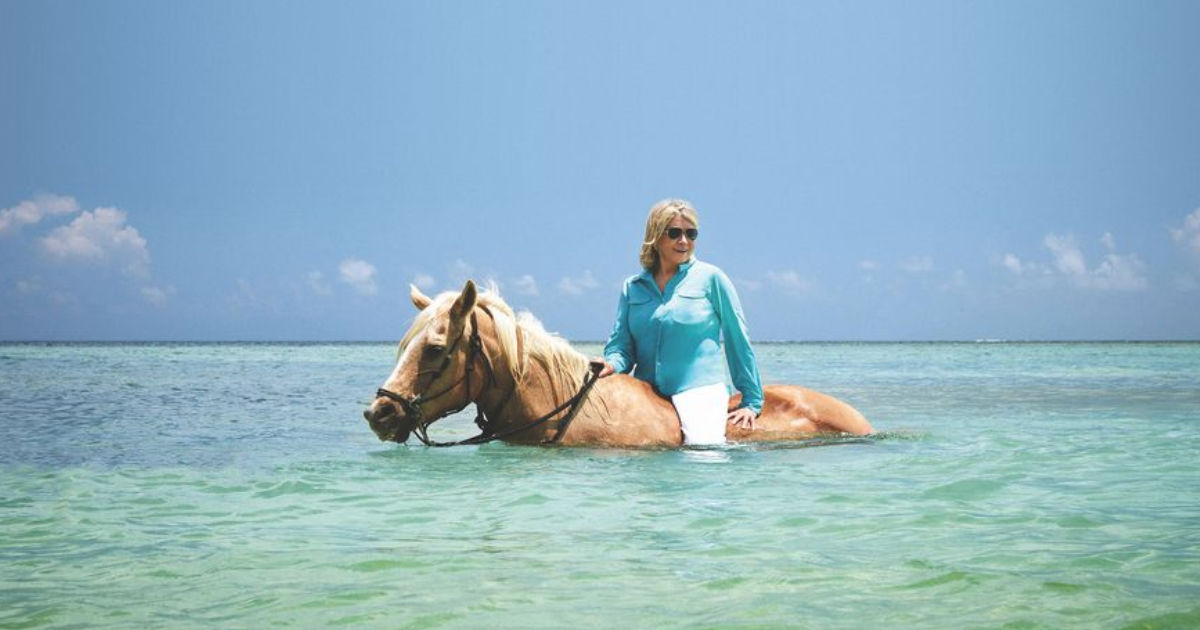 Martha Stewart on horseback in the ocean