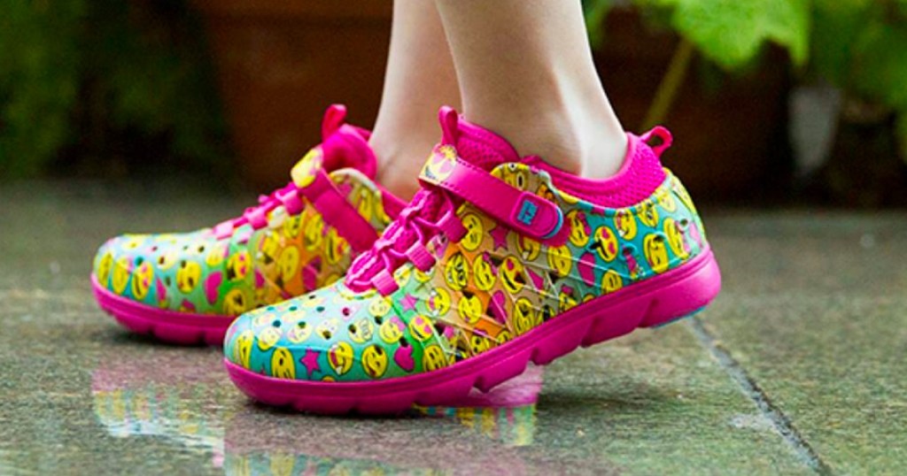 Girl wearing stride rite Pink Emoji Made2Play Phibian Sneaker Sandal