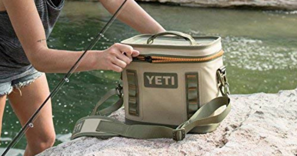 YETI Flip Cooler on ground with person fishing