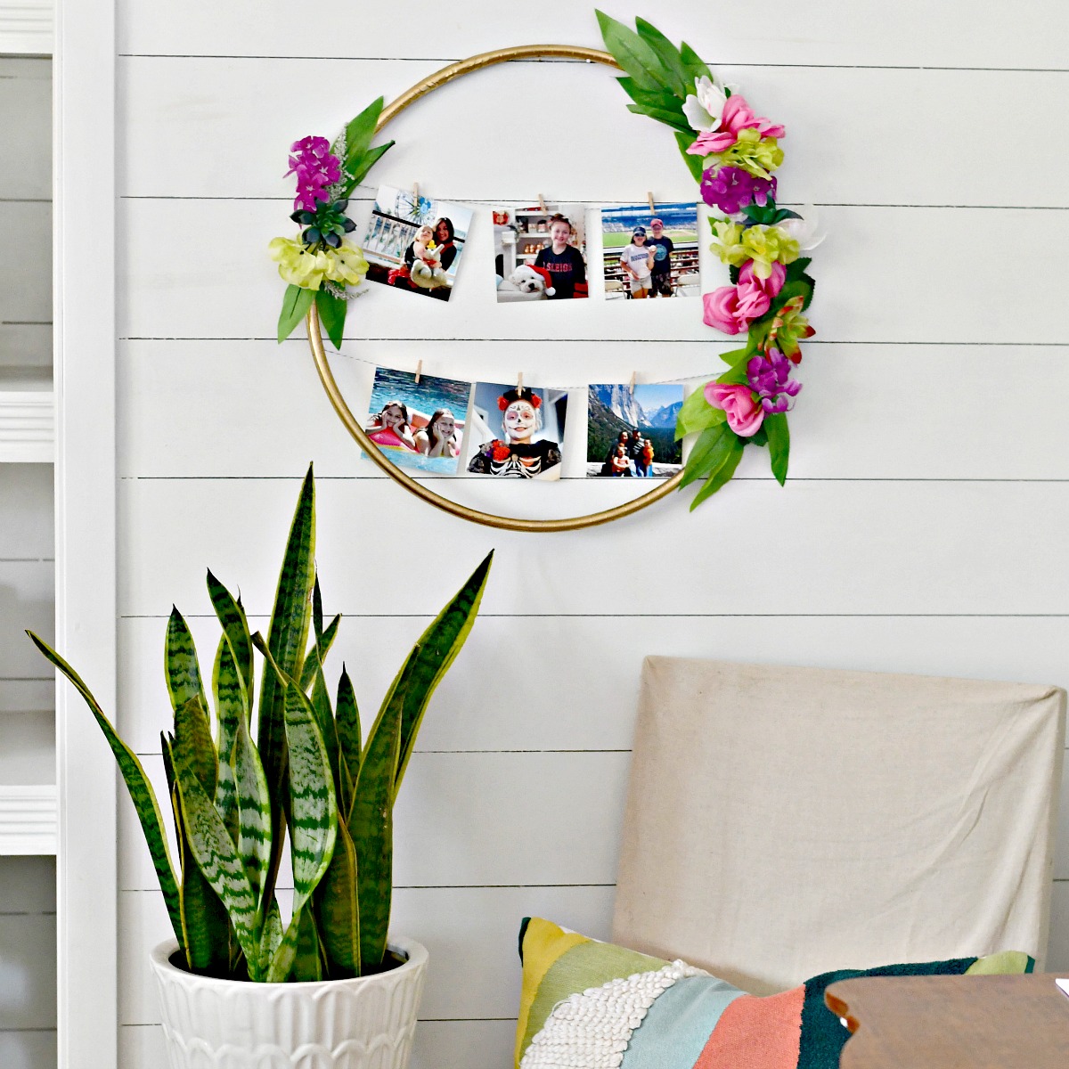 finished photo frame next to a snake plant and covered chair