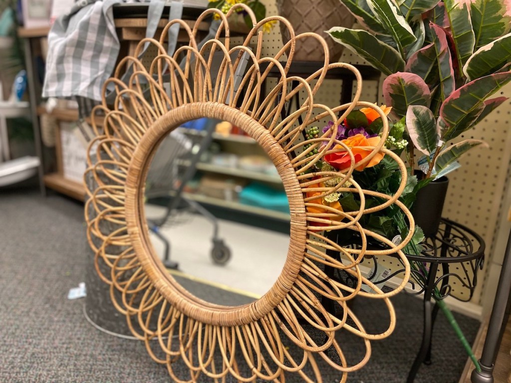 natural colored woven rattan mirror on store floor