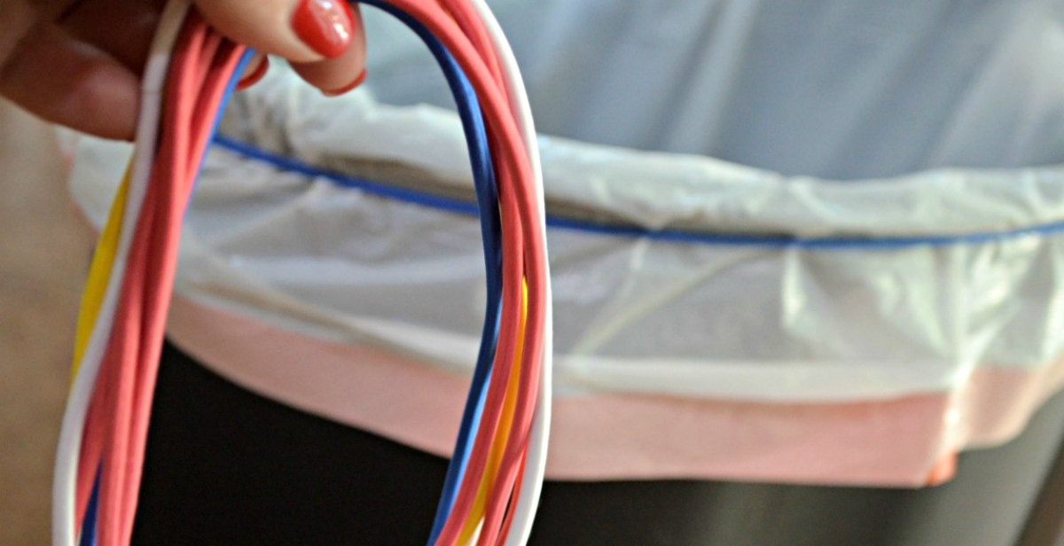 kitchen hack use a headband to secure a trash bag