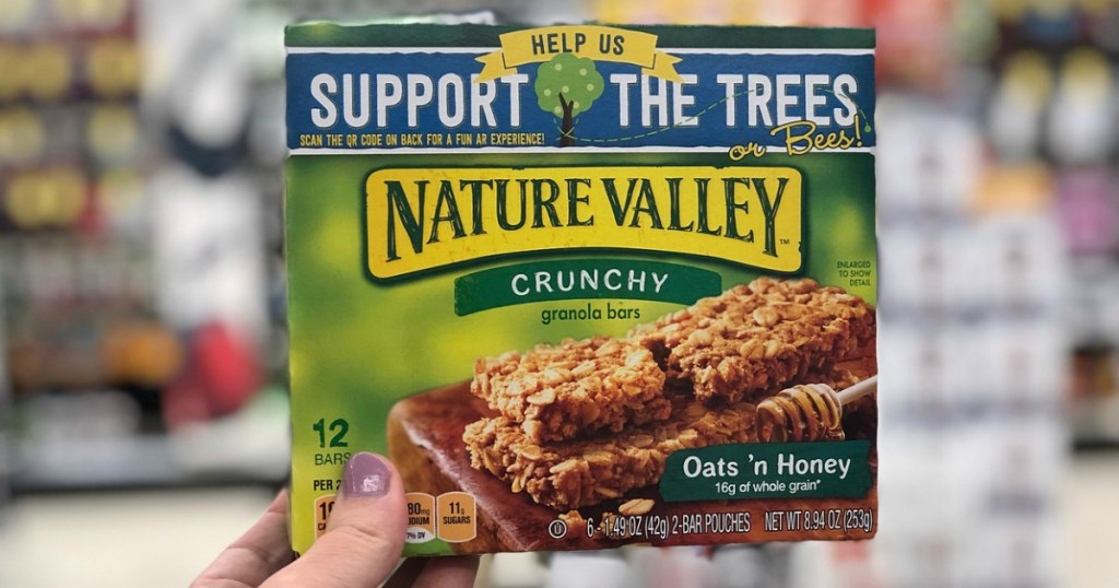 hand holding a box of Nature Valley bars