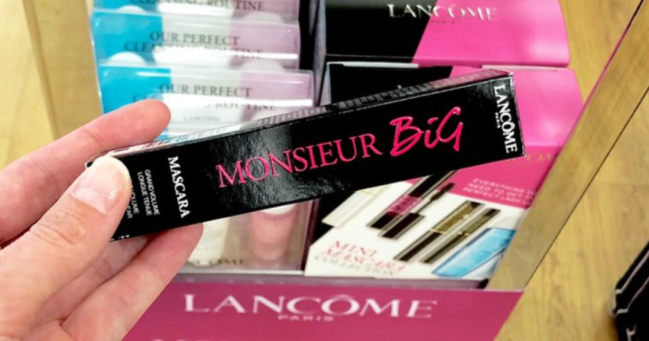 hand holding a Lancome mascara