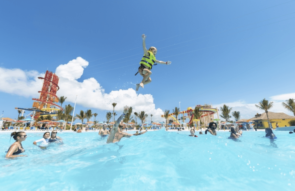 a kid in a wave pool wearing a flotation device at CocoCay