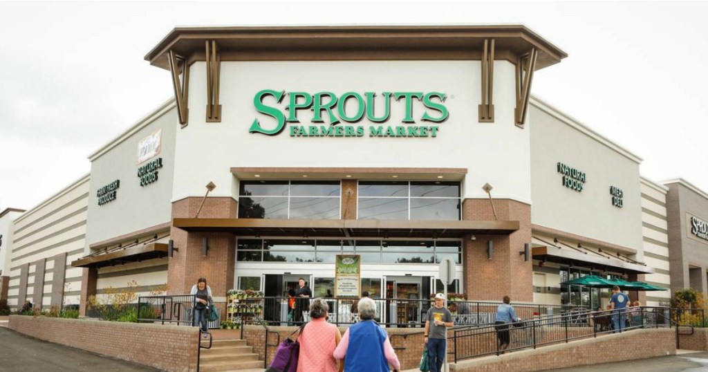store front of sprouts farmers market with people walking in and out of the building