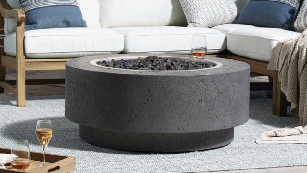 round firepit on patio with sectional sofa