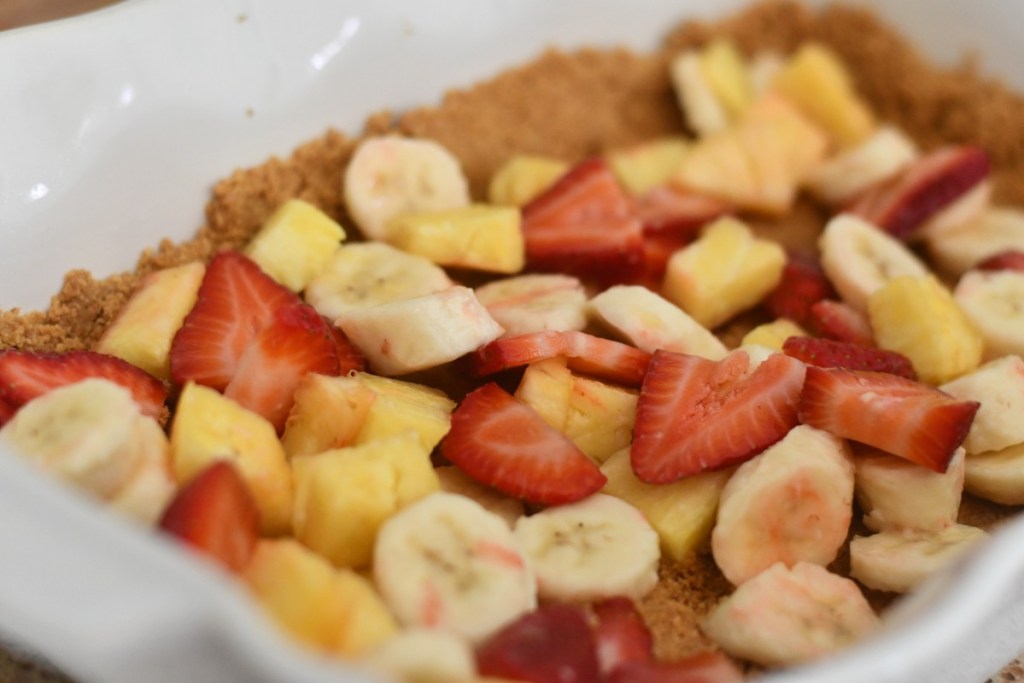 layer of fruit on graham cracker crust