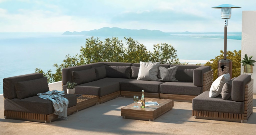 teak slated wood outdoor conversation set with tables on outdoor in front of mountain view