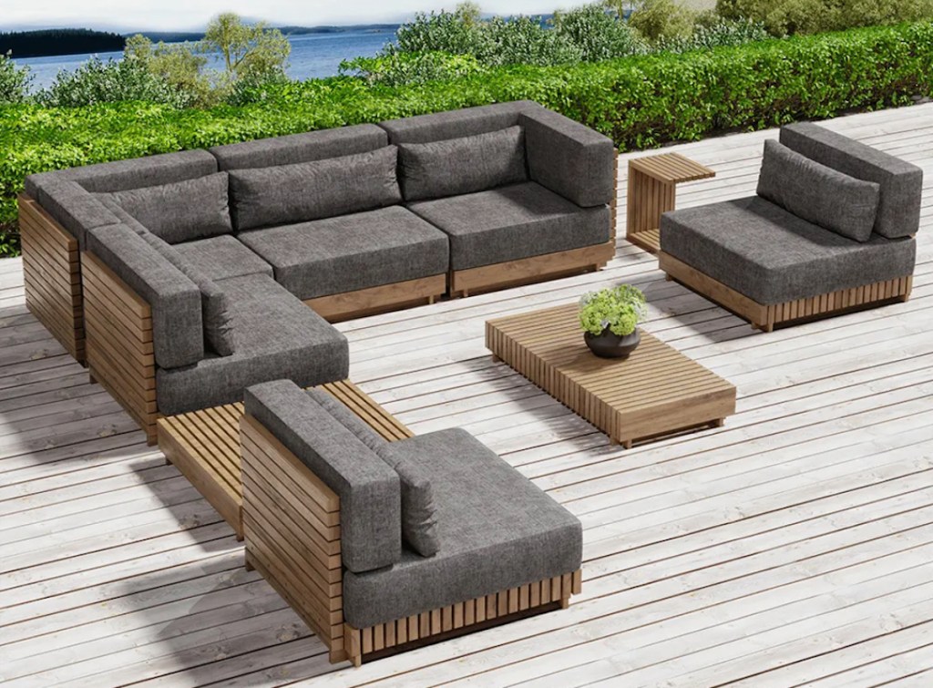 teak slated wood outdoor conversation set with tables on outdoor deck