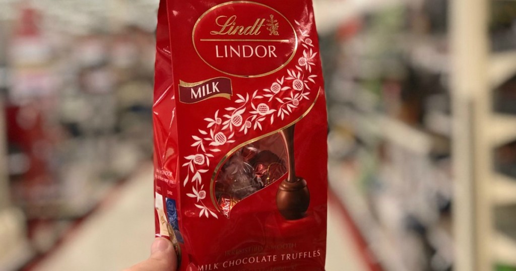 hand holding bag of lindor truffles