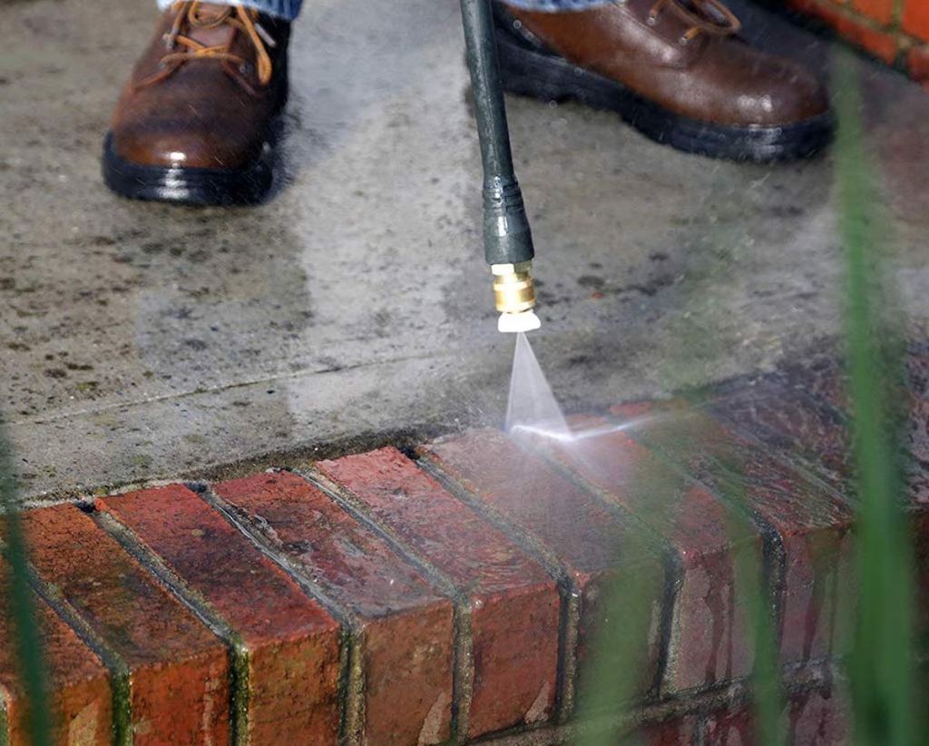hose power washing brick sidewalk - selling your home