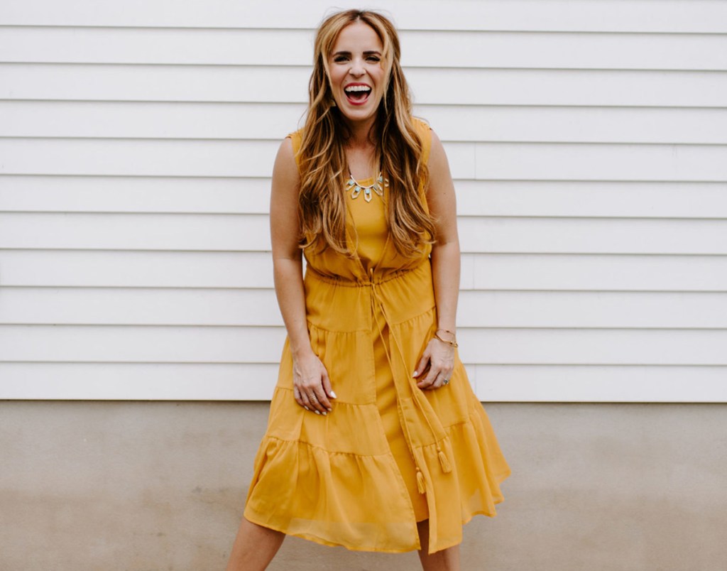 rachel hollis wearing mustard yellow sheer dress