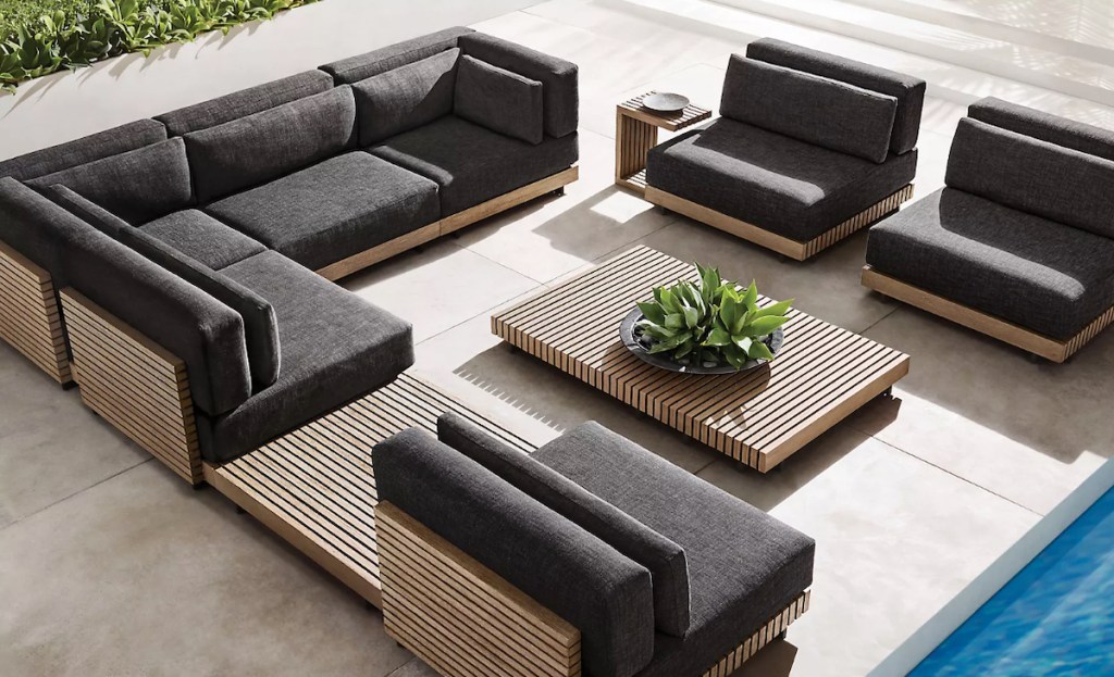 teak slated wood outdoor conversation set with tables on outdoor patio