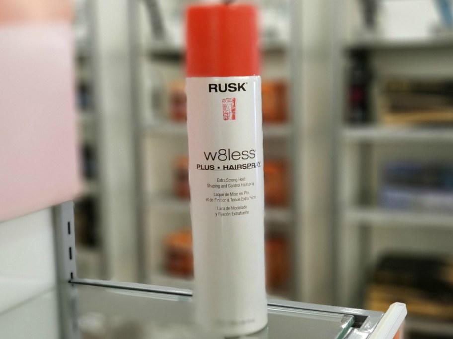rusk hair spray on table