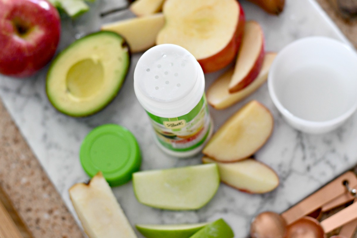 container of Ball-Fruit fresh on the Counter with sliced produce