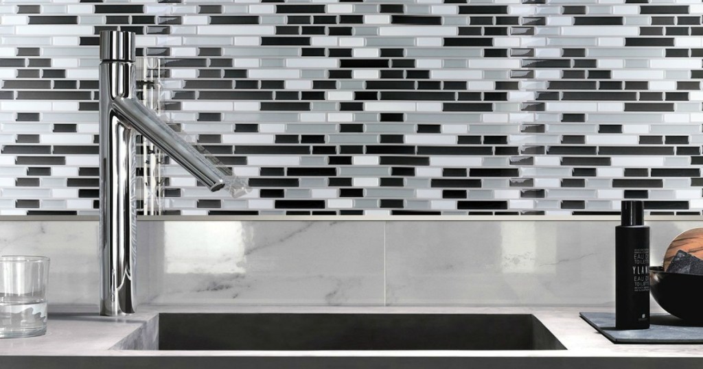 white, black and gray backsplash tiles and sink in kitchen