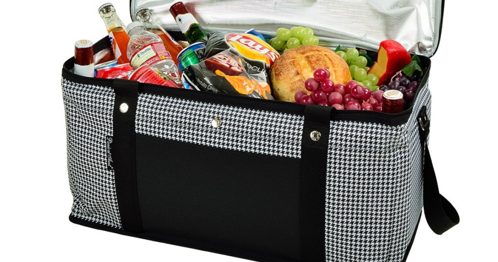 cloth cooler full of fruits, bread, and beverages