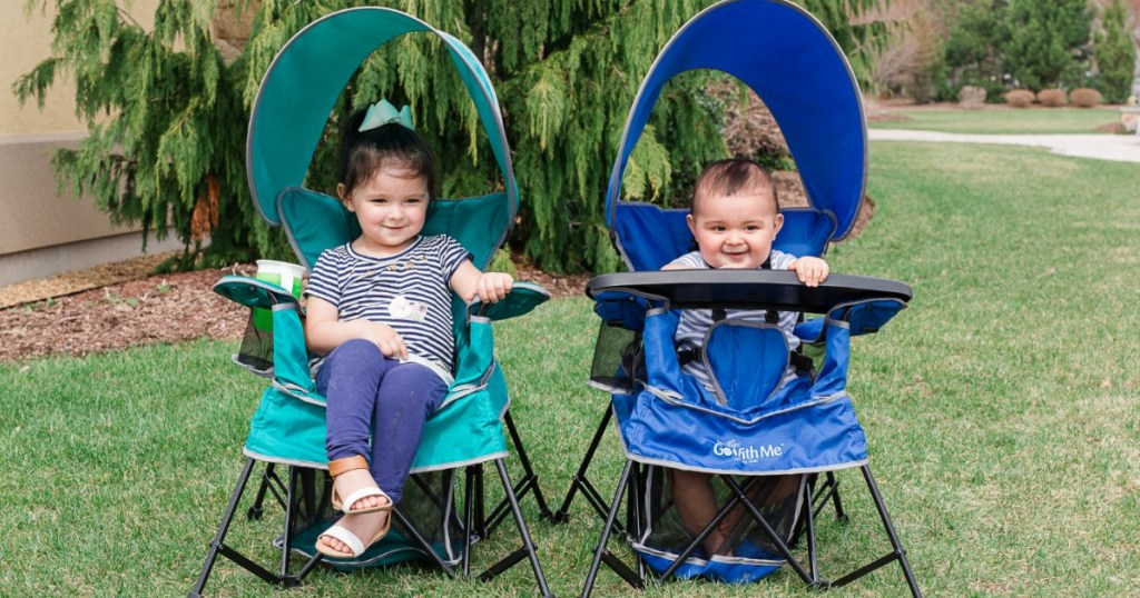 Kids sitting outside in a Baby Delight Go With Me Portable Indoor/Outdoor Chair
