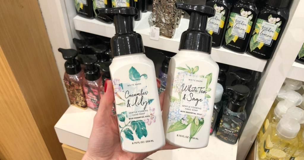 hand holding cucumber & lilly and white tea & sage hand soap at bath and body works