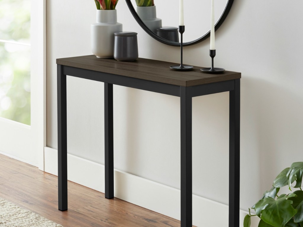 borwn table with candles and decor on it