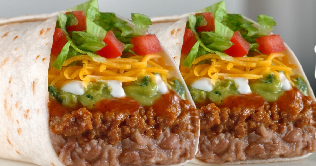 two burritos with lettuce, tomatoes, cheese, and more