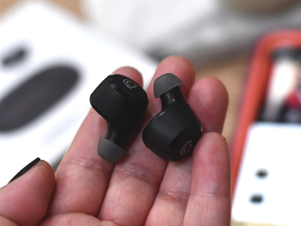 Hand holding CHISANA Wireless Bluetooth Earbuds w/ Portable Charging Case