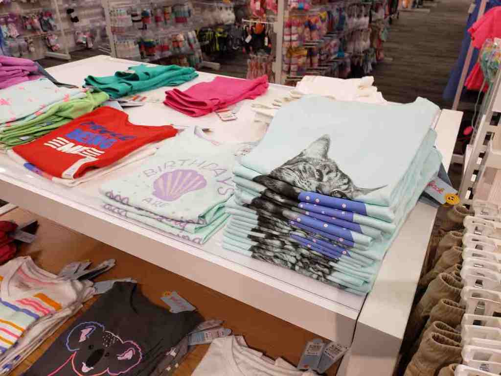 Cat & Jack kids tees on table in Target store