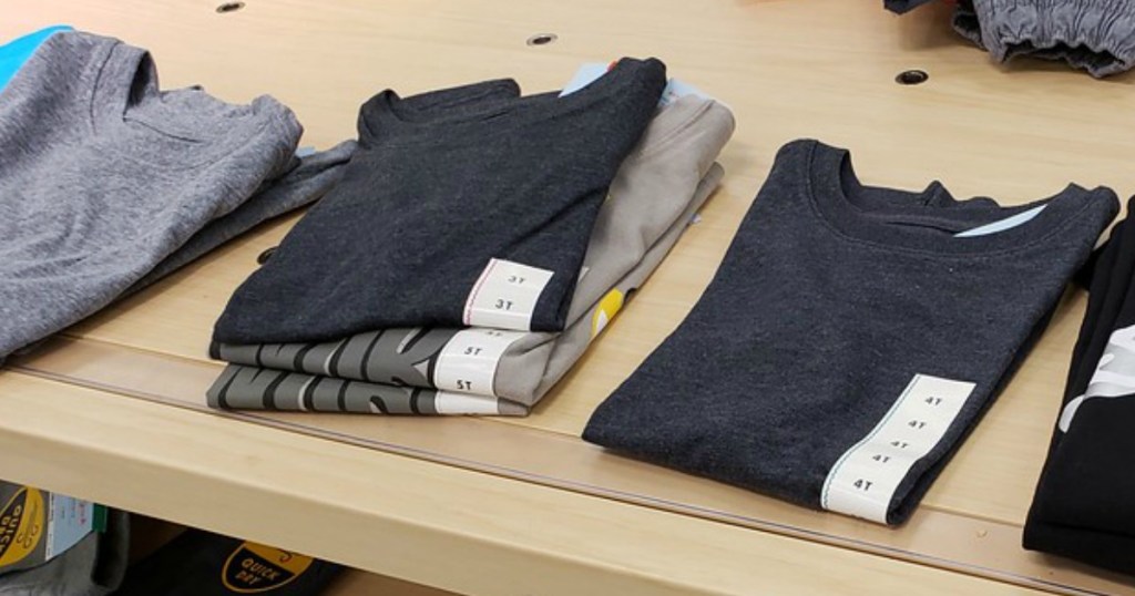 Cat & Jack kids t-shirts laying on a table