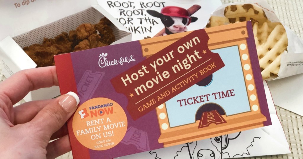 hand holding Chick-Fil-A activity booklet