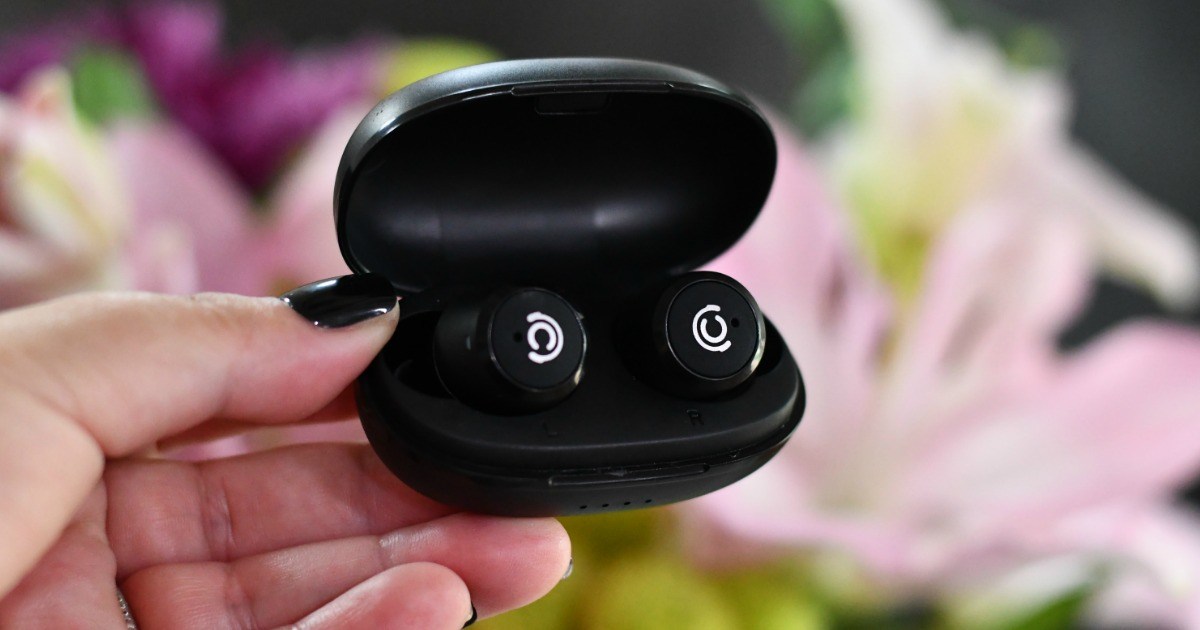 hand holding earbuds