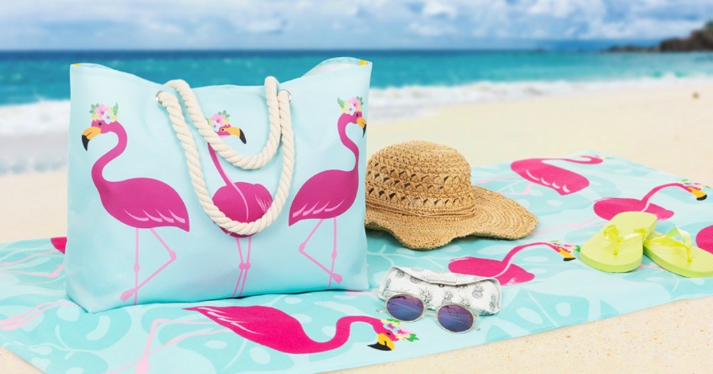 Flamingo towel on the beach with a matching flamingo tote