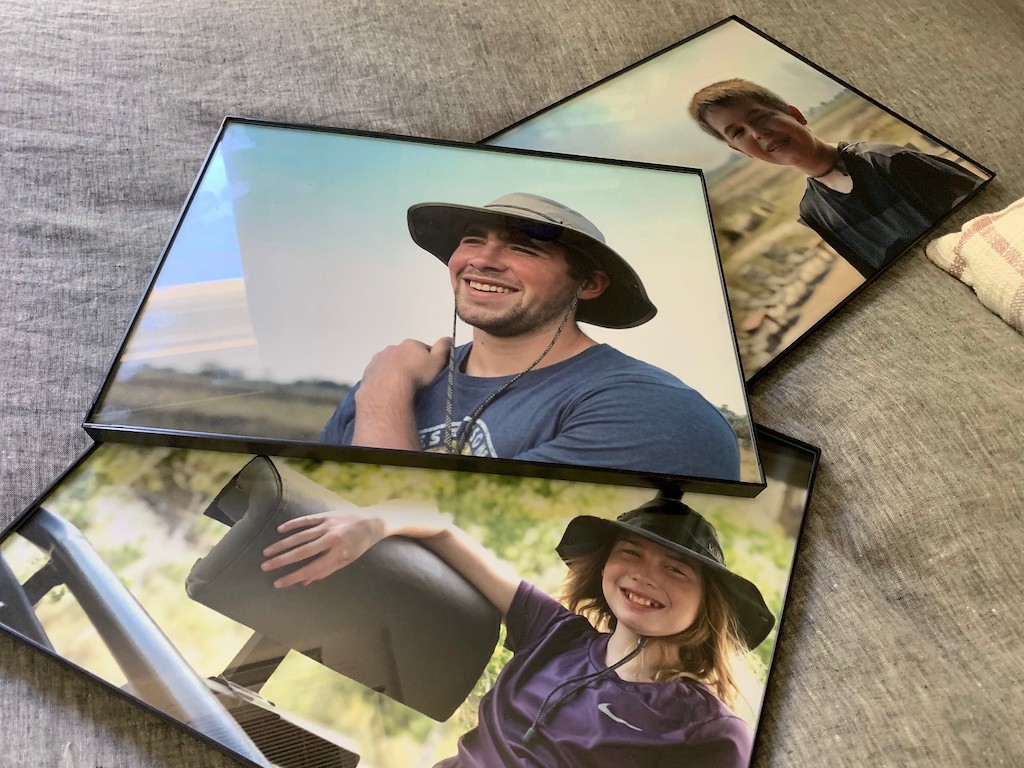3 framed poster prints of two boys and a girl