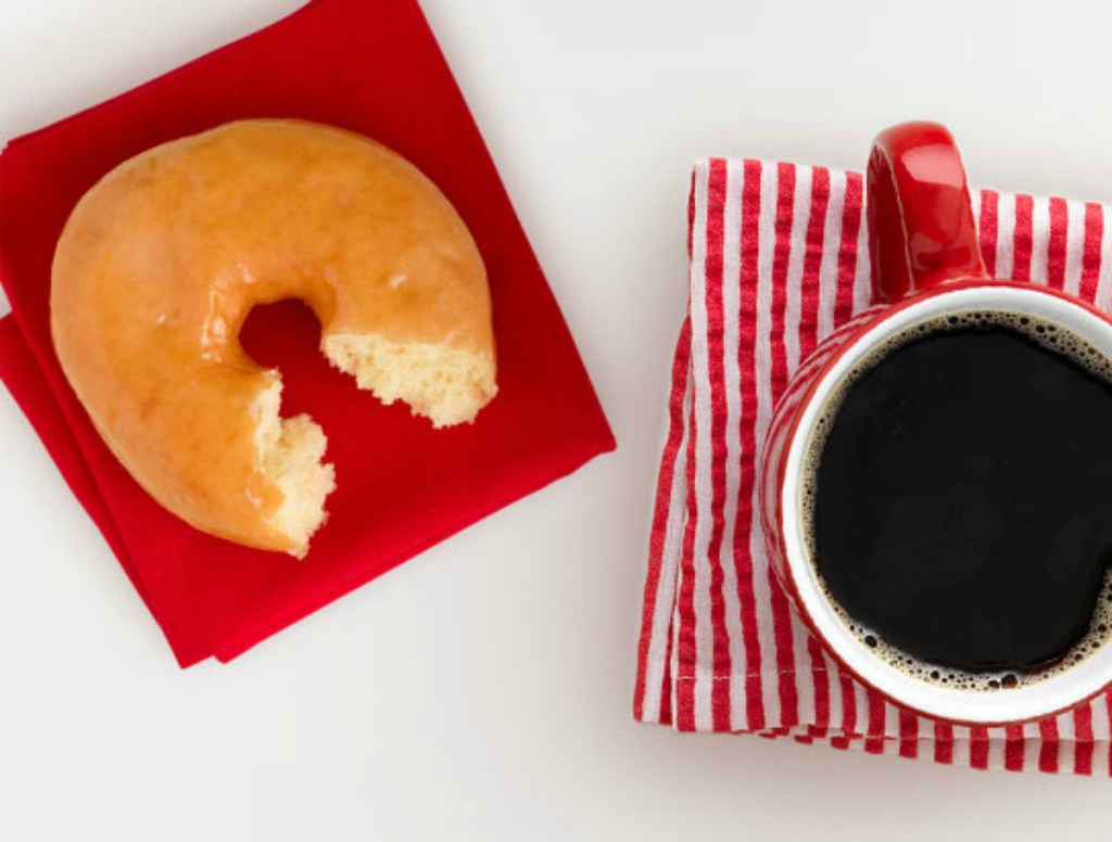 donut and coffee sitting on counter