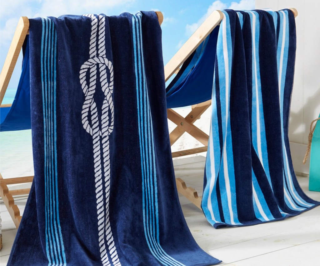 coastal beach towels hanging on chairs by the beach