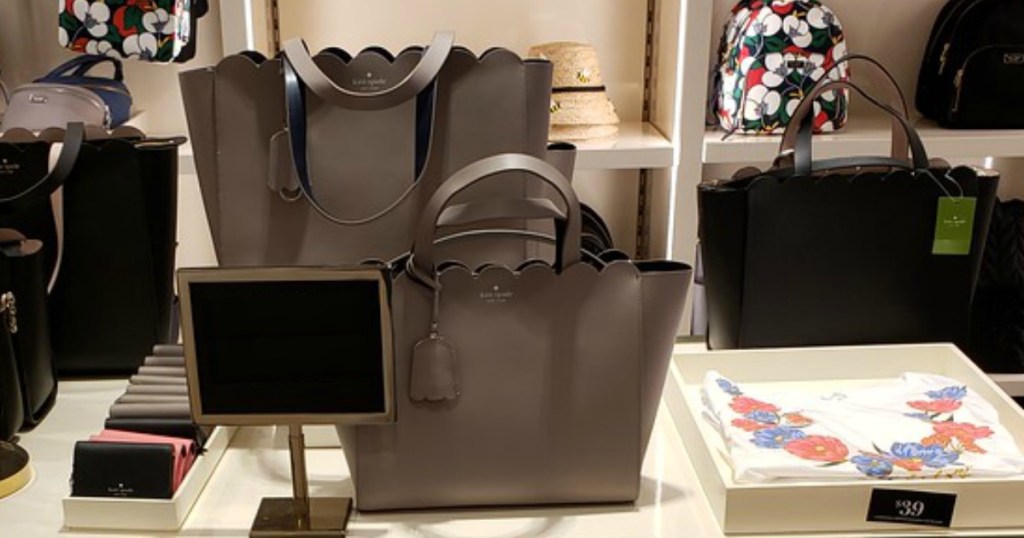 purple Kate Spade purse in the Kate Spade store