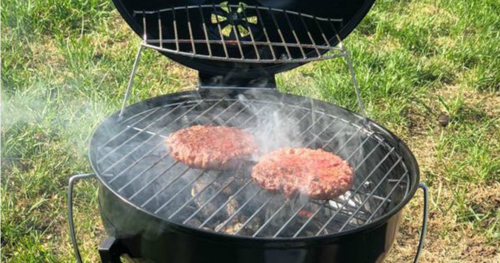 black kingsford portable grill grilling 2 burgers