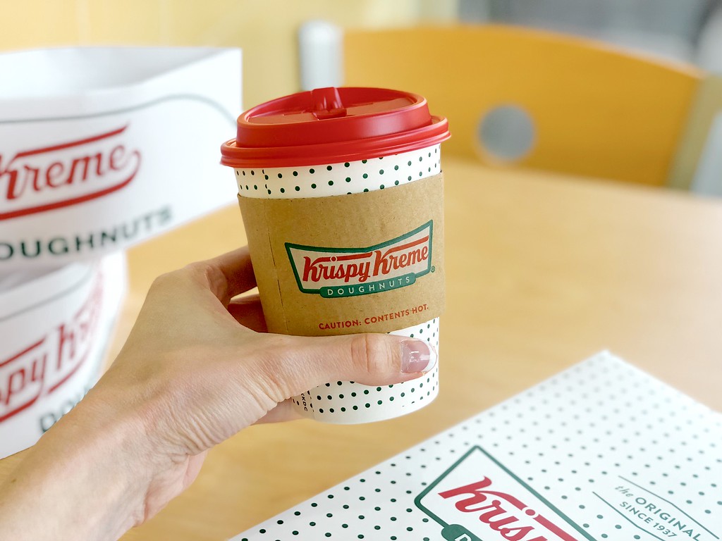 Krispy Kreme Coffee Cup being held by a woman