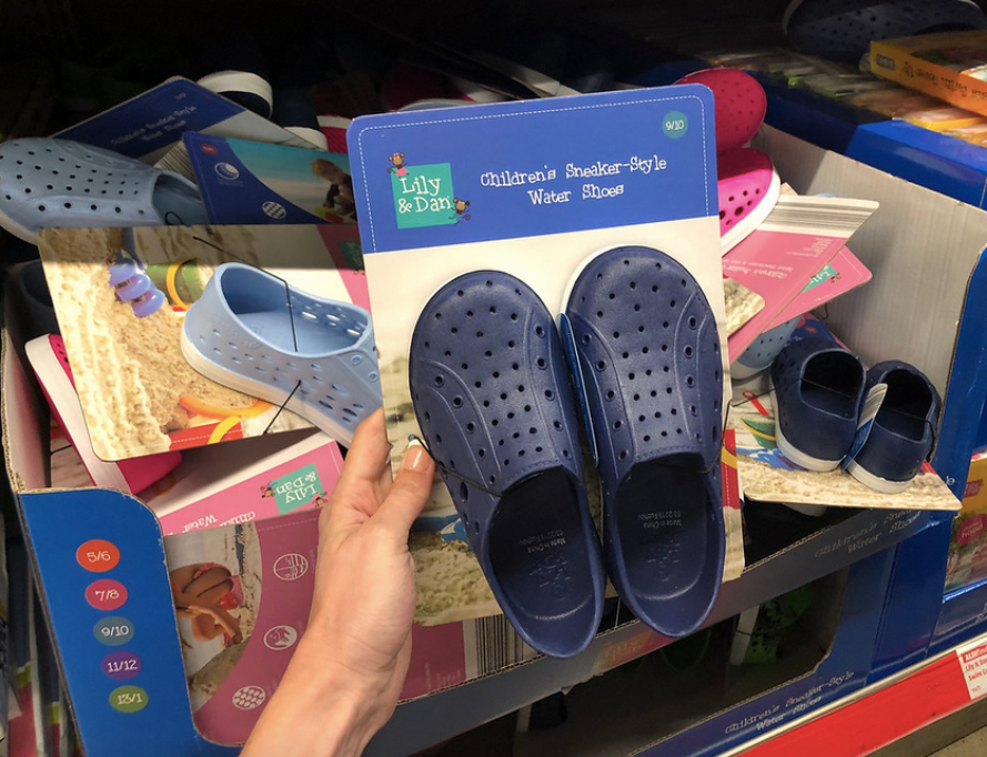 Woman holding pair of Lily & Dan Children's Sneaker-Style Water Shoes 