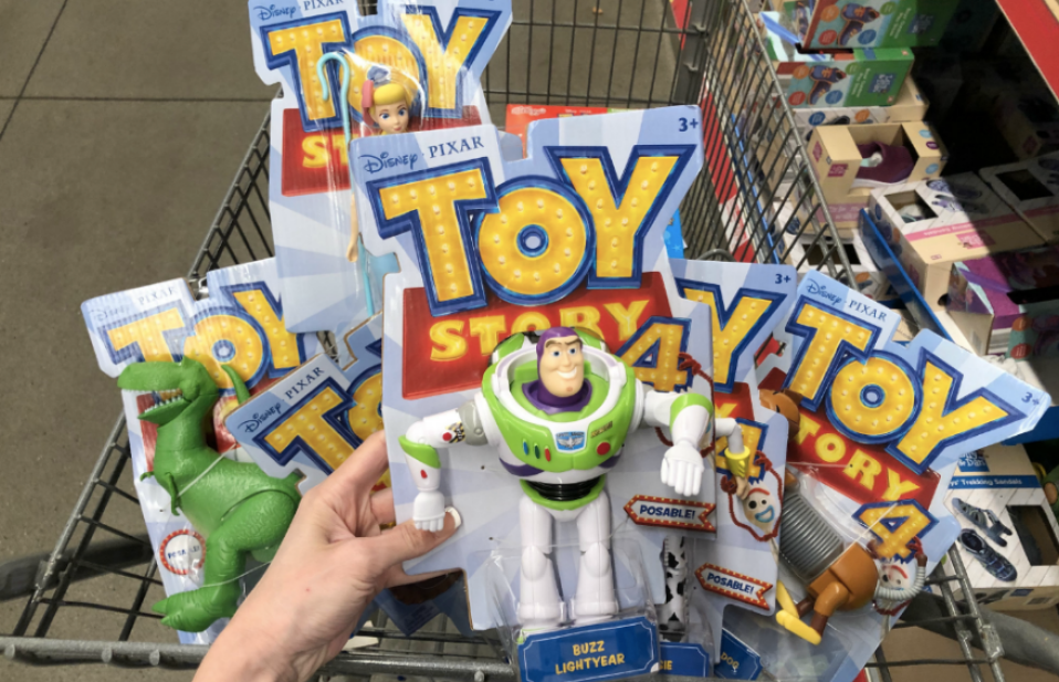 Woman holding Mattel Toy Story 4 Figures in ALDI